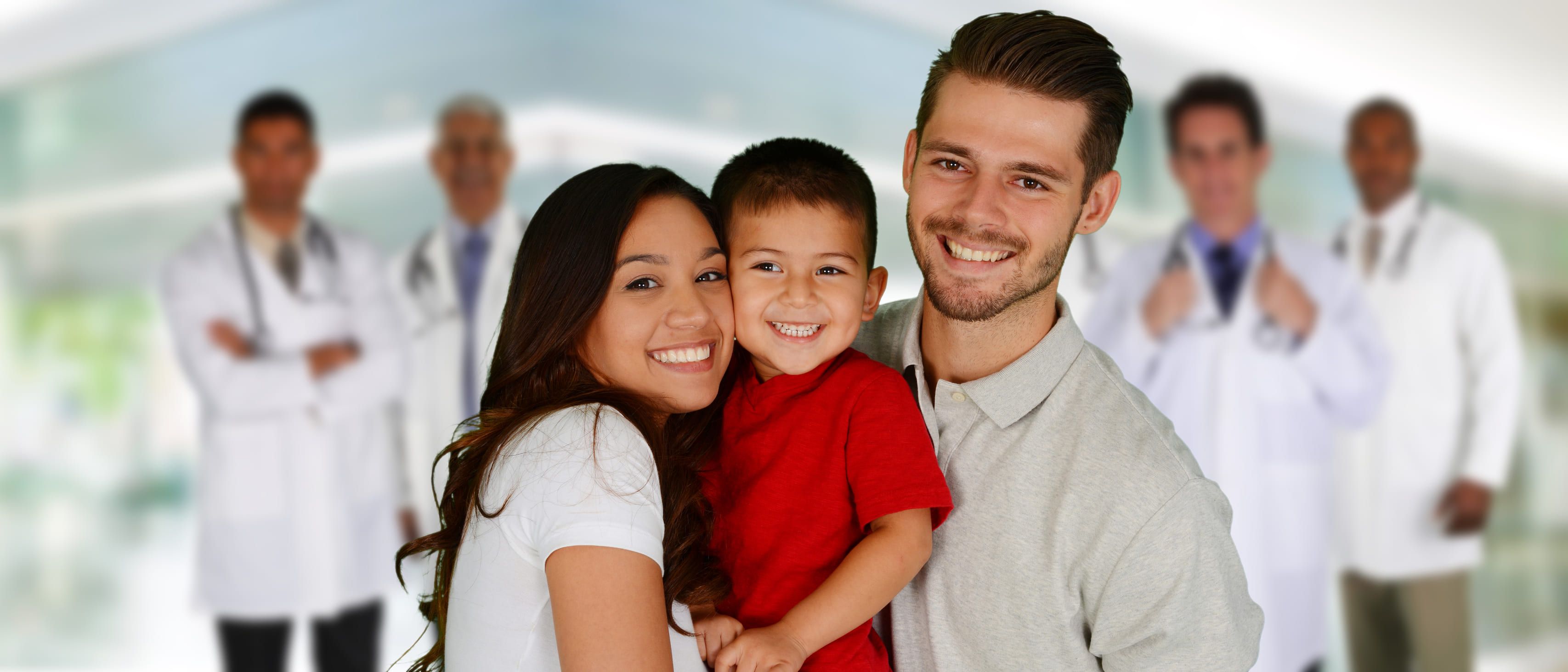 Family smiling in front of doctors TV Discount Drug